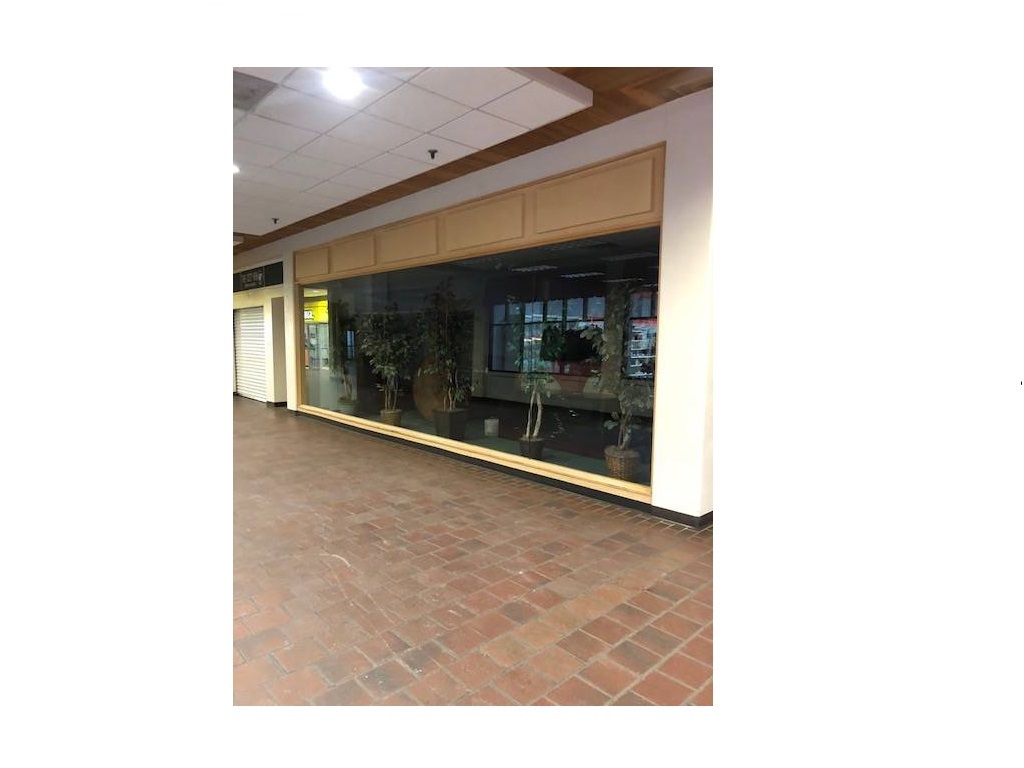 Store front of space 13 for lease in the Holiday Center